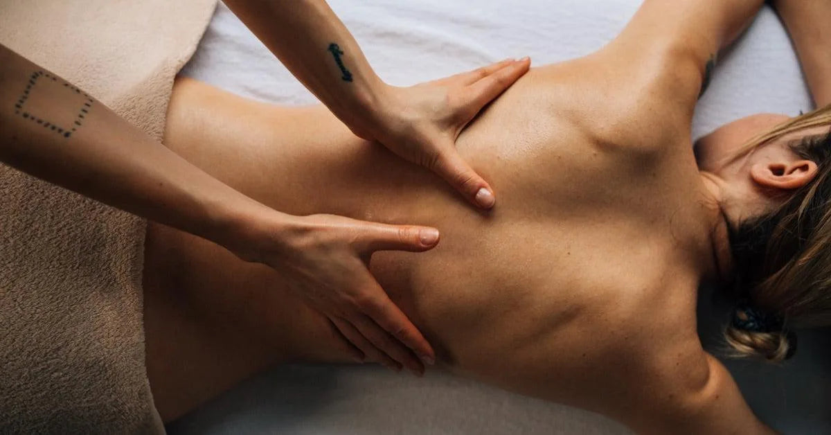 Focused massage pressure on a guest’s back